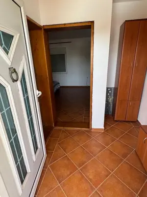 a hallway with a tiled floor in a house at Agron apartments in Ulcinj