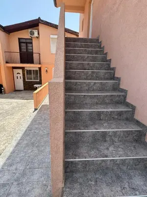 a set of stairs in front of a building at Agron apartments in Ulcinj
