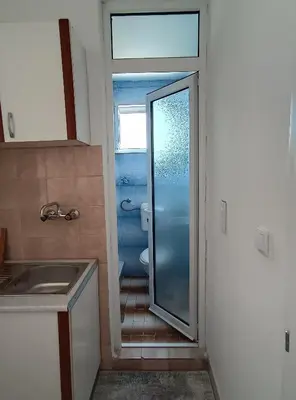 a bathroom with a shower and a sink and a toilet at Jasmin 4 in Ulcinj