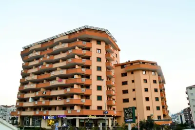 a tall apartment building in a city at Jelena in Budva