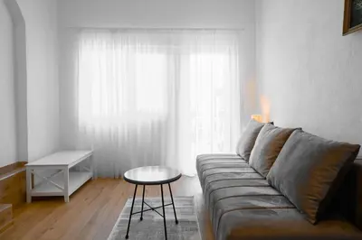 a living room with a couch and a table at Harmony Point in Bar
