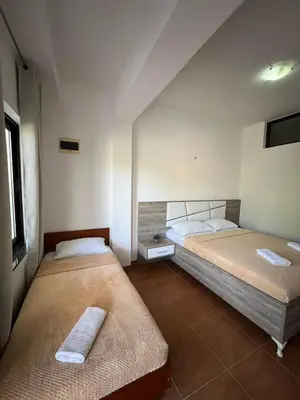 a bedroom with two beds in a room at Enes Apartments in Ulcinj