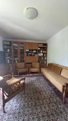 a living room with a large couch and a table at Golden Bay Apartment in Kotor