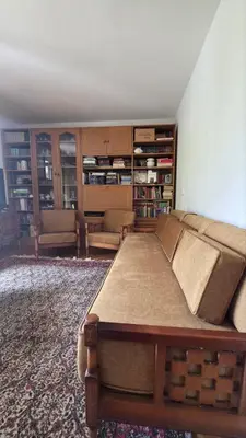 a living room with a bed and a couch at Golden Bay Apartment in Kotor