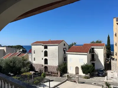 a view from the balcony of a building at Studio Sea View Steps to Przno beach w Parking Villa Olive in Pržno