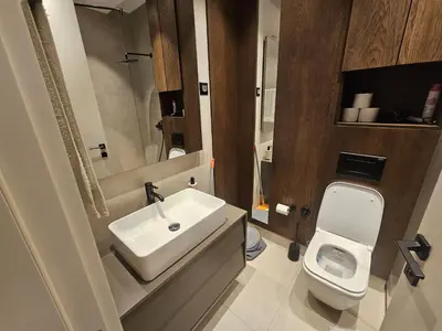 a bathroom with a white sink and a toilet at Montebay Apartment in Becici