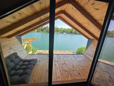 a view from the inside of a gazebo on a lake at CabinAtRiver Ada Bojana in Ulcinj