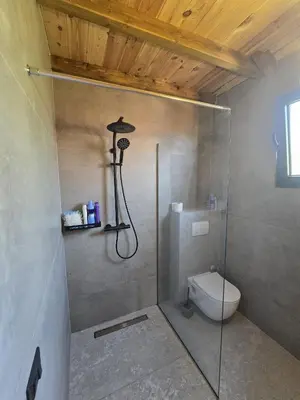 a bathroom with a shower and a toilet at CabinAtRiver Ada Bojana in Ulcinj
