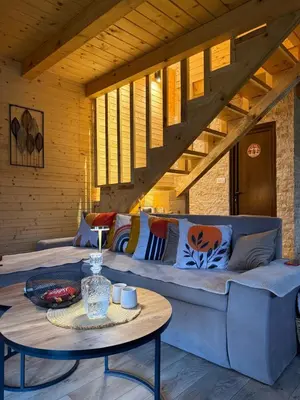a living room with a couch and a table at Mountain harmony Lovćen in Cetinje