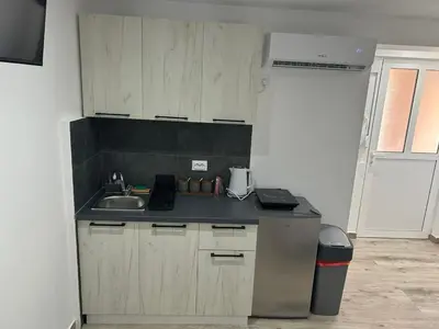 a kitchen with a sink and a counter top at Apartmani Filipovic in Podgorica