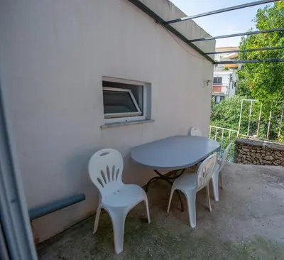 a table and two chairs sitting on a patio at Lana Apartments in Ulcinj