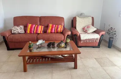 a living room with a couch and a coffee table at Kalina in Bigovo