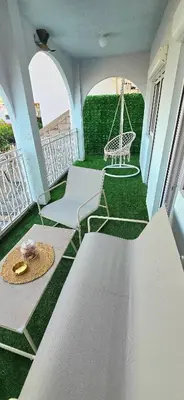 a balcony with a hammock and a swing at Alpha Casa in Bar