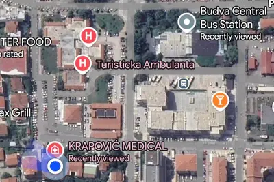 a map of a city with buildings and signs at Sunset Bay Budva in Budva