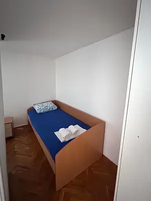 a small room with a bed in a box at Sunset Bay Budva in Budva