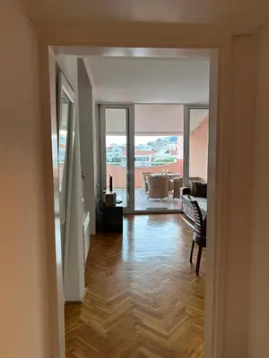 a hallway with a room with a tub and a piano at Sunset Bay Budva in Budva