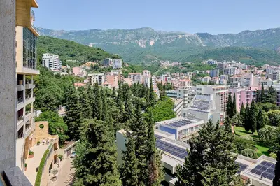 a view of a city with trees and buildings at Vista Mare Apartments in Budva