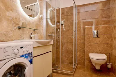 a bathroom with a toilet sink and a shower at Vista Mare Apartments in Budva