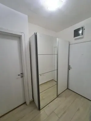 an empty room with a door and a mirror at Apartment Jasovic in Ulcinj