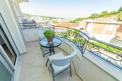 a balcony with a table and chairs and a view at Lida Apartments in Ulcinj