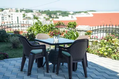 a table and chairs sitting on a patio at Lida Apartments in Ulcinj
