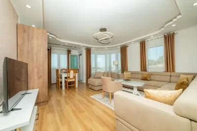 a living room with a couch and a table at Lida Apartments in Ulcinj