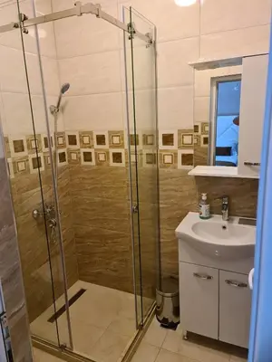 a bathroom with a shower and a sink at Lida Apartments in Ulcinj