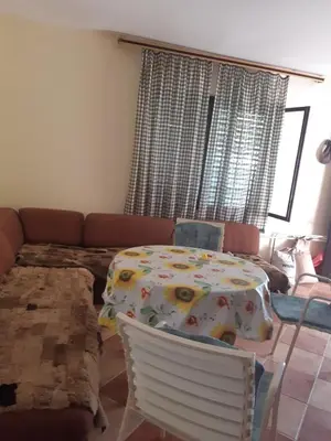 a room with a table and a couch at Kruce accommodation in Ulcinj