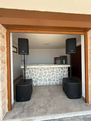 two speakers in a room with a wall with a stone wall at Salakovic Country Estate in Bar