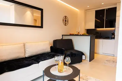 a living room with a couch and a table at Apartman Katica in Becici