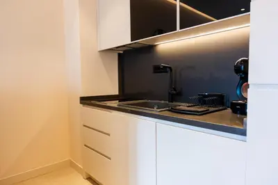 a kitchen with a sink and a counter top at Apartman Katica in Becici