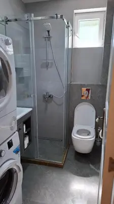 a bathroom with a shower with a toilet and a sink at Comfort in Budva