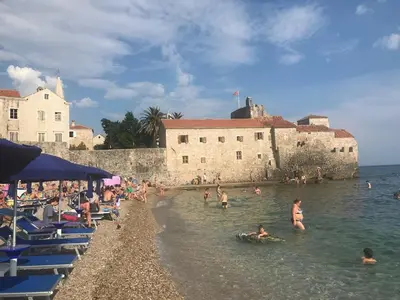 a group of people in the water at a beach at Budva Old City Central Studio Private in Budva