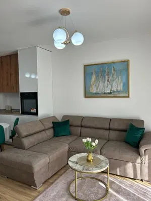 a living room with a couch and a table at Pearl Wave-Apartment in Ulcinj
