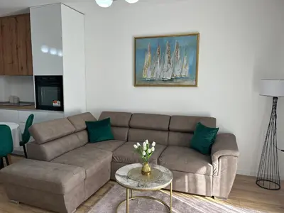 a living room with a couch and a table at Pearl Wave-Apartment in Ulcinj