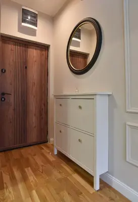 a room with a dresser and a mirror next to a door at Comfy one-bdr apartment Sara in Budva