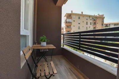 a balcony with a bench and a window at Comfy one-bdr apartment Sara in Budva