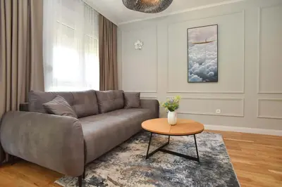 a living room with a couch and a table at Comfy one-bdr apartment Staša in Budva