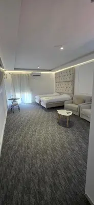 a living room with a couch and a table at KASIJA Apartman in Podgorica