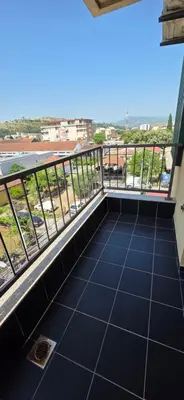 a balcony with a view of a city at KASIJA Apartman in Podgorica