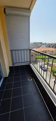 a balcony with a view of a city at KASIJA Apartman in Podgorica