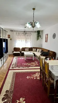a living room with a couch and a table at Adria spa Rafailovici in Becici