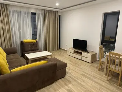 a living room with a couch and a flat screen tv at AB LUX Apartmani 401 in Sutomore