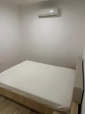 a mattress sitting on the floor in a room at AB LUX Apartmani 401 in Sutomore
