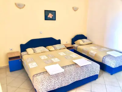 a room with two beds in a room at Delfini Holiday Homes in Ulcinj
