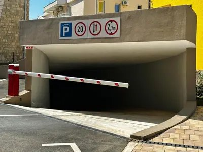 a parking lot entrance to a parking garage at Harmony Sun 39 in Bar