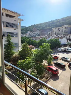 a balcony with a view of a parking lot at MiraBlu - New Modern Apartment - FREE parking in Budva