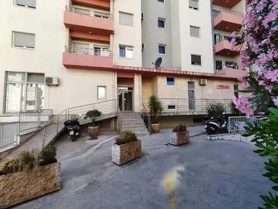 an empty parking lot in front of a building at MiraBlu - New Modern Apartment - FREE parking in Budva