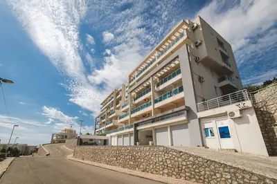 a building on the side of a road at VISTA Kalamper MONTENEGRO in Dobra Voda