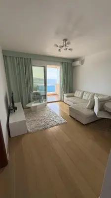 a living room with a couch and a table at VISTA Kalamper MONTENEGRO in Dobra Voda